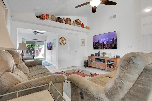 204 Bay Meadow Dr, Kissimmee, FL 34746 - living area featuring a ceiling fan, tile patterned floors, baseboards, and high vaulted ceiling