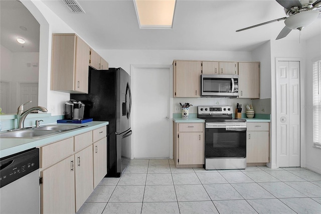 204 Bay Meadow Dr, Kissimmee, FL 34746 - kitchen featuring stainless steel appliances, a sink, light countertops, a ceiling fan, and light tile patterned flooring