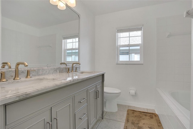 204 Bay Meadow Dr, Kissimmee, FL 34746 - bathroom with plenty of natural light, double vanity, tile patterned floors, and toilet