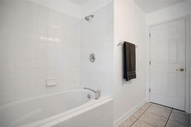 204 Bay Meadow Dr, Kissimmee, FL 34746 - full bathroom with tile patterned floors, baseboards, and tiled shower / bath combo