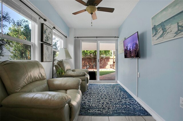204 Bay Meadow Dr, Kissimmee, FL 34746 - living area with a ceiling fan and baseboards