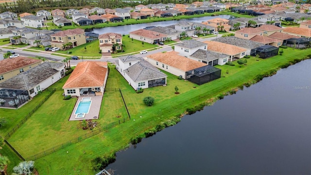 aerial perspective of suburban area with a large body of water