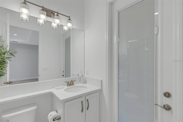 bathroom featuring toilet and vanity