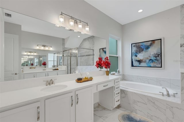 bathroom with a stall shower, a bath, vanity, and marble finish flooring