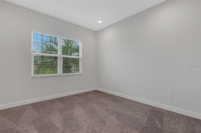 carpeted spare room with baseboards and recessed lighting