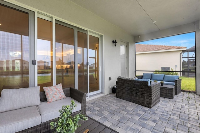 view of patio / terrace featuring outdoor lounge area and a water view