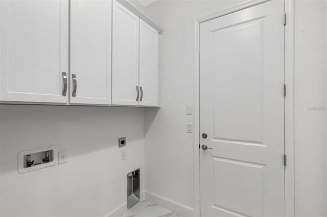 washroom featuring cabinet space, hookup for an electric dryer, hookup for a washing machine, baseboards, and marble finish floors
