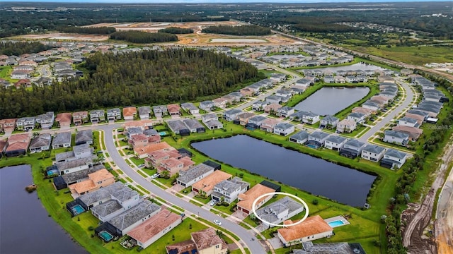 aerial overview of property's location with a large body of water and nearby suburban area