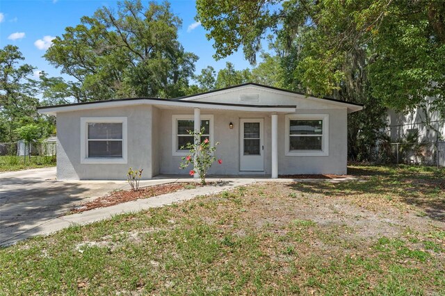 614 Plum Ln, Altamonte Springs, FL 32701 - view of front facade featuring stucco siding and covered porch