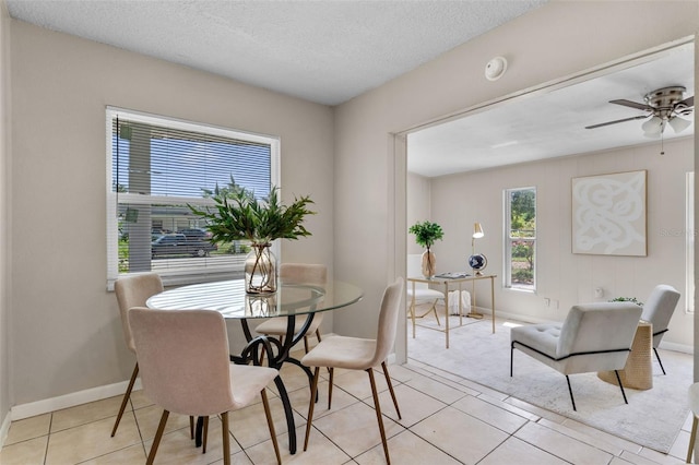 614 Plum Ln, Altamonte Springs, FL 32701 - dining room with a ceiling fan, light tile patterned floors, baseboards, and a textured ceiling