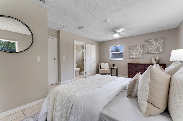 614 Plum Ln, Altamonte Springs, FL 32701 - bedroom featuring light tile patterned floors, baseboards, connected bathroom, a textured ceiling, and attic access