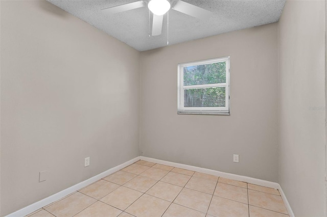 614 Plum Ln, Altamonte Springs, FL 32701 - unfurnished room featuring light tile patterned floors, baseboards, a textured ceiling, and a ceiling fan