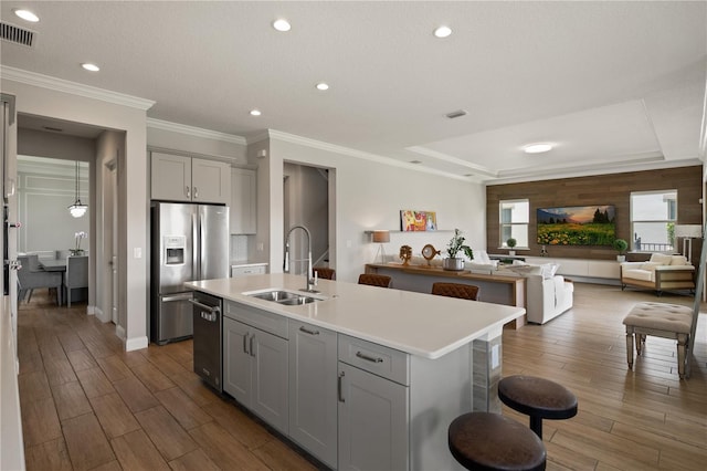 10529 Royal Cypress Way, Orlando, FL 32836 - kitchen featuring gray cabinetry, appliances with stainless steel finishes, wood finished floors, light countertops, and recessed lighting