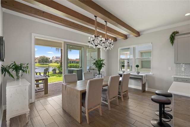 10529 Royal Cypress Way, Orlando, FL 32836 - dining area with beam ceiling, a chandelier, light wood-style flooring, and a water view