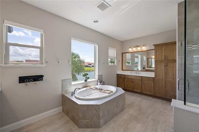 10529 Royal Cypress Way, Orlando, FL 32836 - full bath with vanity, a bath, and a shower stall