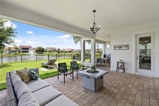 10529 Royal Cypress Way, Orlando, FL 32836 - view of patio / terrace featuring an outdoor living space with a fire pit, a water view, and a residential view