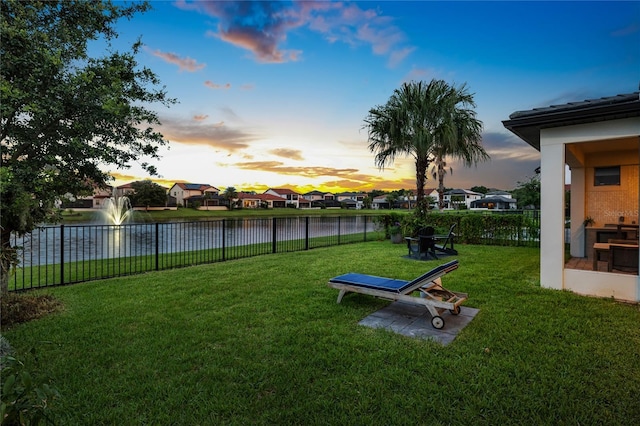 10529 Royal Cypress Way, Orlando, FL 32836 - yard at dusk with a water view and a residential view