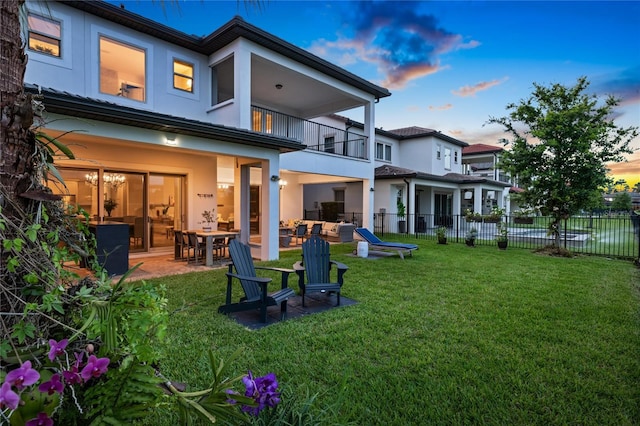 10529 Royal Cypress Way, Orlando, FL 32836 - back of house featuring a balcony, a patio area, and stucco siding