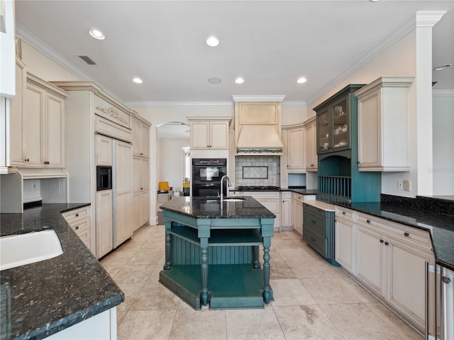 6161 Blakeford Dr, Windermere, FL 34786 - kitchen featuring paneled built in refrigerator, decorative backsplash, dark stone countertops, cream cabinetry, and crown molding