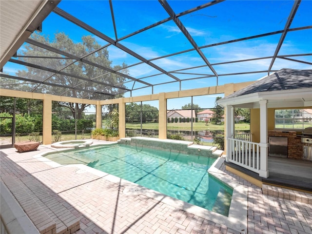 6161 Blakeford Dr, Windermere, FL 34786 - view of swimming pool with a patio area, a pool with connected hot tub, glass enclosure, and a water view