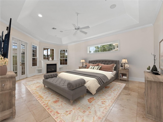 6161 Blakeford Dr, Windermere, FL 34786 - bedroom with a tray ceiling, recessed lighting, a fireplace, ornamental molding, and ceiling fan