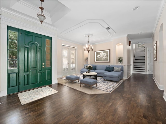 6161 Blakeford Dr, Windermere, FL 34786 - foyer entrance featuring wood finished floors, stairs, a chandelier, ornamental molding, and arched walkways