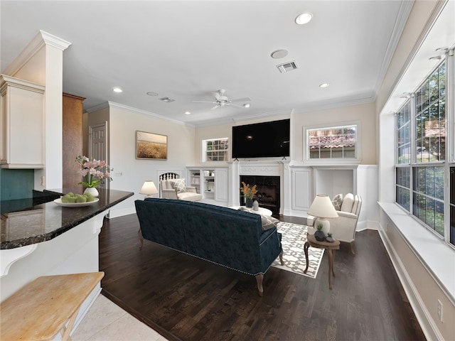 6161 Blakeford Dr, Windermere, FL 34786 - living room with a fireplace, ceiling fan, plenty of natural light, dark wood-type flooring, and recessed lighting