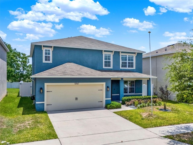 5967 Churchill Square Way, Groveland, FL 34736 - view of front of home with stucco siding, driveway, an attached garage, and a shingled roof