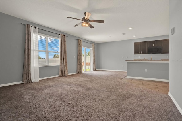 5967 Churchill Square Way, Groveland, FL 34736 - unfurnished living room with a ceiling fan, light carpet, baseboards, and light tile patterned floors