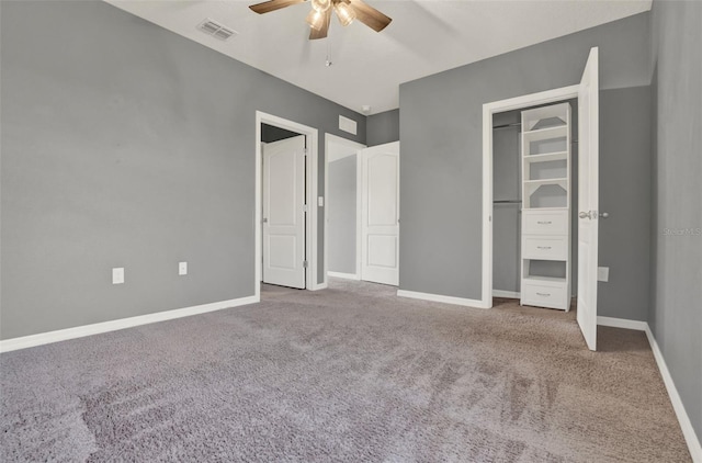 5967 Churchill Square Way, Groveland, FL 34736 - unfurnished bedroom with carpet floors, baseboards, ceiling fan, and a closet