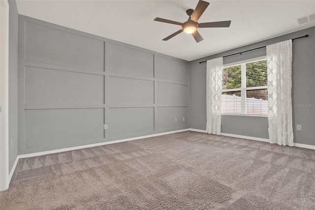 5967 Churchill Square Way, Groveland, FL 34736 - carpeted spare room featuring a ceiling fan, baseboards, and a decorative wall