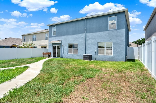 5967 Churchill Square Way, Groveland, FL 34736 - back of house with stucco siding and cooling unit
