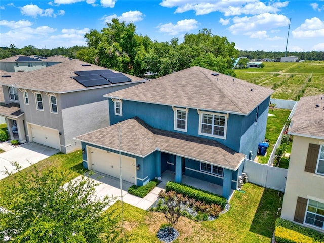 5967 Churchill Square Way, Groveland, FL 34736 - view of front of home featuring a shingled roof, stucco siding, driveway, and an attached garage