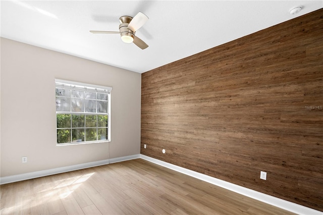 2125 Shackley Pl, Apopka, FL 32703 - spare room with ceiling fan, wood walls, wood finished floors, and a smoke detector