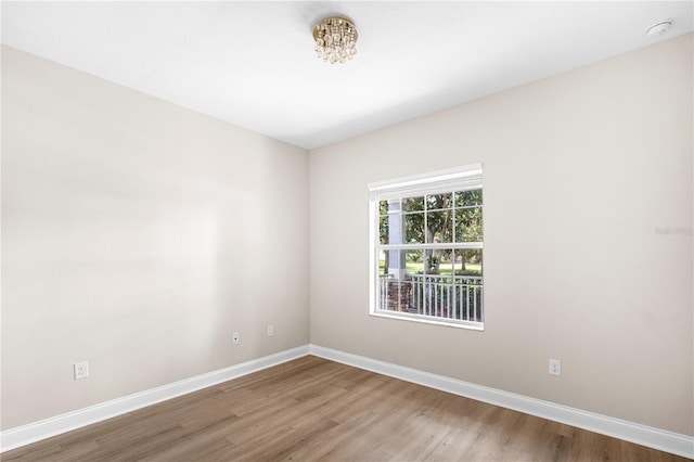 2125 Shackley Pl, Apopka, FL 32703 - unfurnished room with wood finished floors and a smoke detector