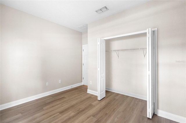2125 Shackley Pl, Apopka, FL 32703 - unfurnished bedroom with light wood-style floors and a closet