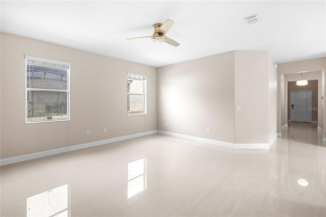 2125 Shackley Pl, Apopka, FL 32703 - empty room with a ceiling fan and light tile patterned floors