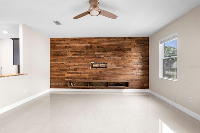 2125 Shackley Pl, Apopka, FL 32703 - unfurnished living room featuring wooden walls and a ceiling fan