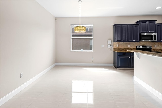2125 Shackley Pl, Apopka, FL 32703 - kitchen featuring appliances with stainless steel finishes, decorative backsplash, stone counters, decorative light fixtures, and dark cabinetry