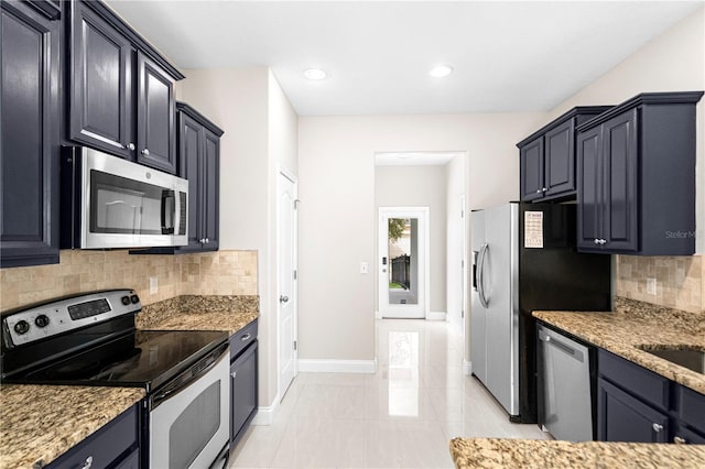 2125 Shackley Pl, Apopka, FL 32703 - kitchen featuring stainless steel appliances, tasteful backsplash, light stone counters, and recessed lighting