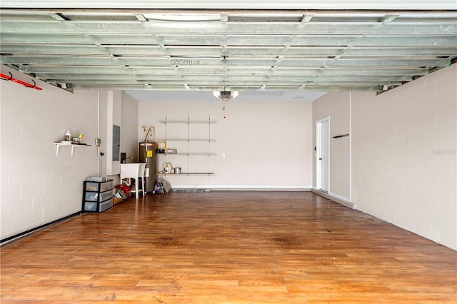 2125 Shackley Pl, Apopka, FL 32703 - garage with a garage door opener, electric panel, concrete block wall, and electric water heater