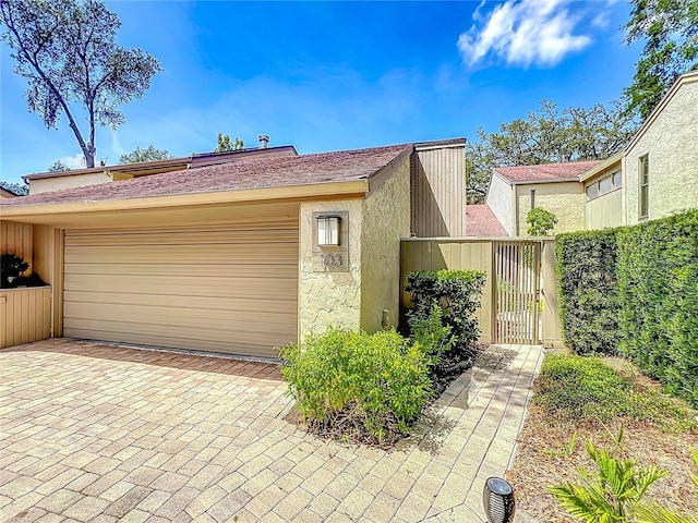 103 Red Cedar Dr, Longwood, FL 32779 - garage featuring a gate and driveway
