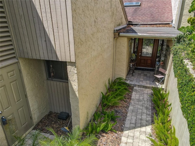 103 Red Cedar Dr, Longwood, FL 32779 - doorway to property featuring stucco siding