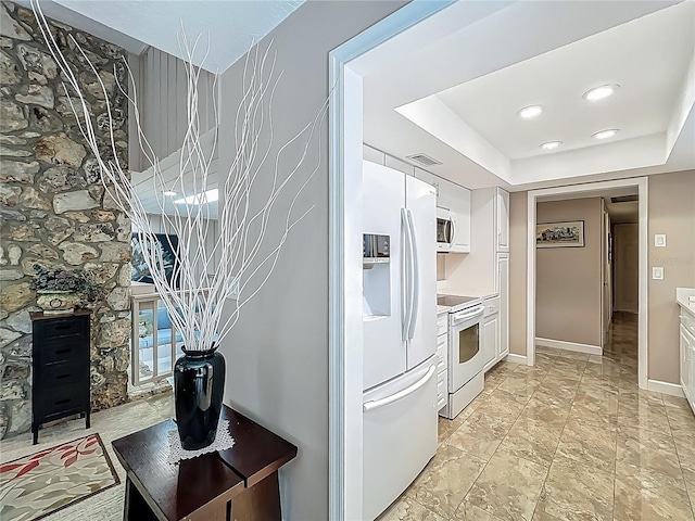 103 Red Cedar Dr, Longwood, FL 32779 - kitchen featuring white appliances, white cabinets, light countertops, baseboards, and recessed lighting