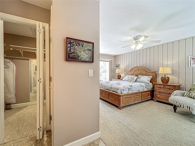 103 Red Cedar Dr, Longwood, FL 32779 - bedroom featuring light colored carpet, baseboards, a ceiling fan, and a walk in closet