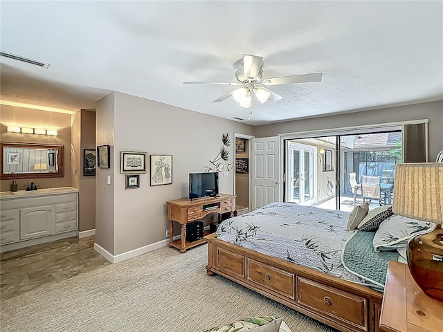 103 Red Cedar Dr, Longwood, FL 32779 - bedroom with access to exterior, baseboards, a sink, a ceiling fan, and light colored carpet