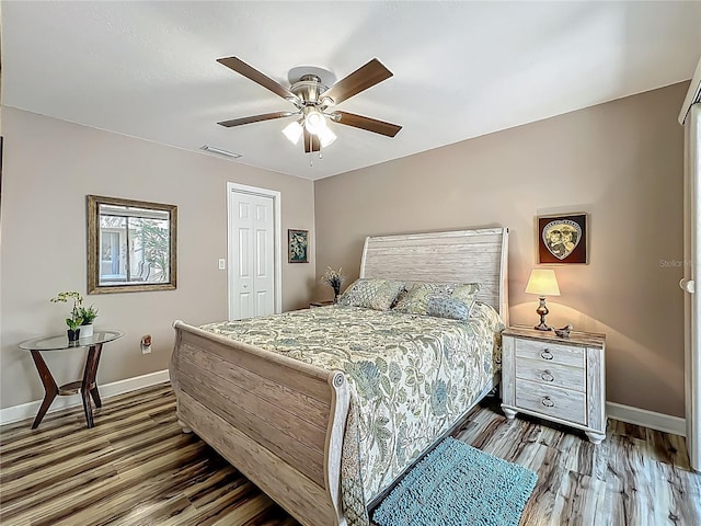 103 Red Cedar Dr, Longwood, FL 32779 - bedroom featuring wood finished floors, baseboards, ceiling fan, and a closet