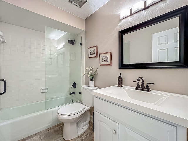 103 Red Cedar Dr, Longwood, FL 32779 - full bathroom featuring vanity, toilet, washtub / shower combination, a textured ceiling, and stone finish floors
