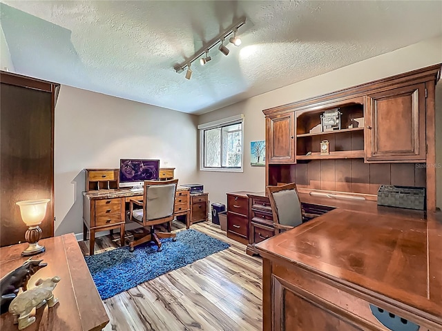 103 Red Cedar Dr, Longwood, FL 32779 - home office with a textured ceiling, light wood-style flooring, and rail lighting
