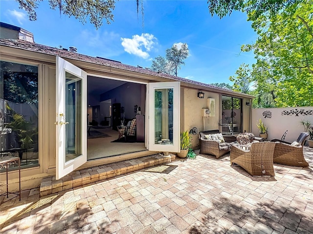 103 Red Cedar Dr, Longwood, FL 32779 - rear view of house with a patio area, outdoor lounge area, and stucco siding